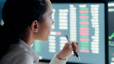 Woman at computer analyzing data