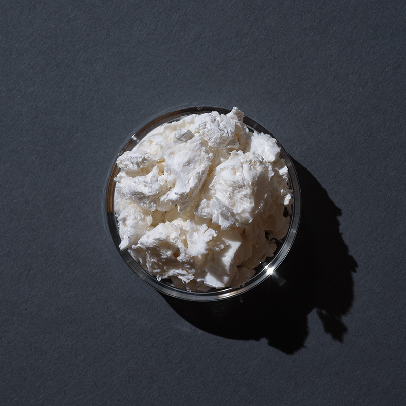 White chunky substance on a dark background