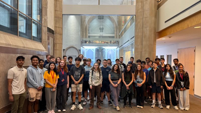 Group of campers standing together in front of RPI's quantum computer