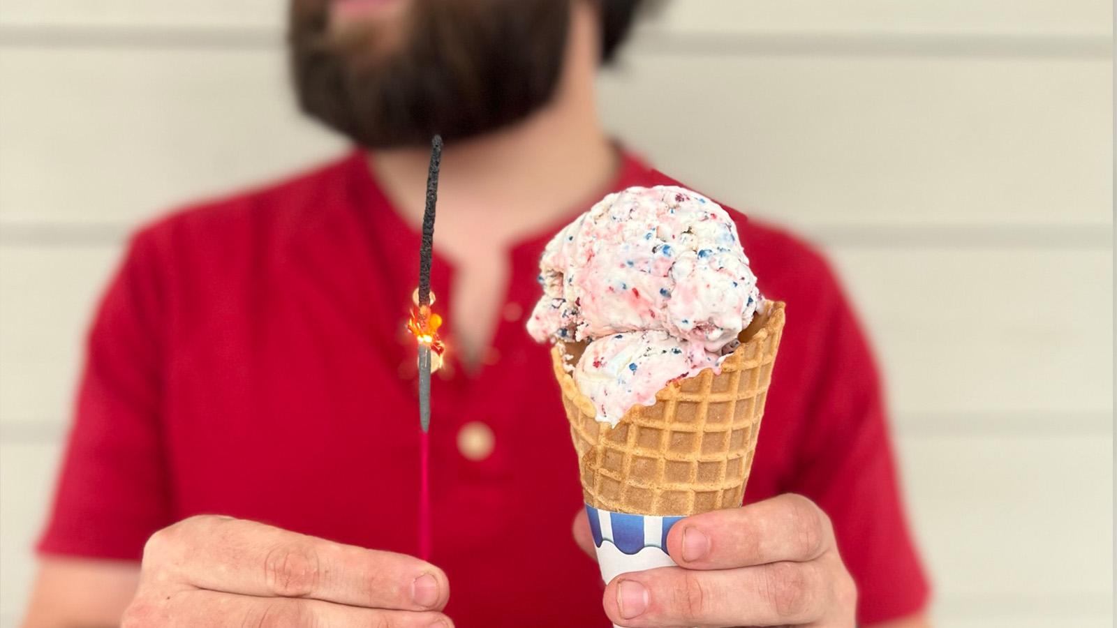 hand holding ice cream cone