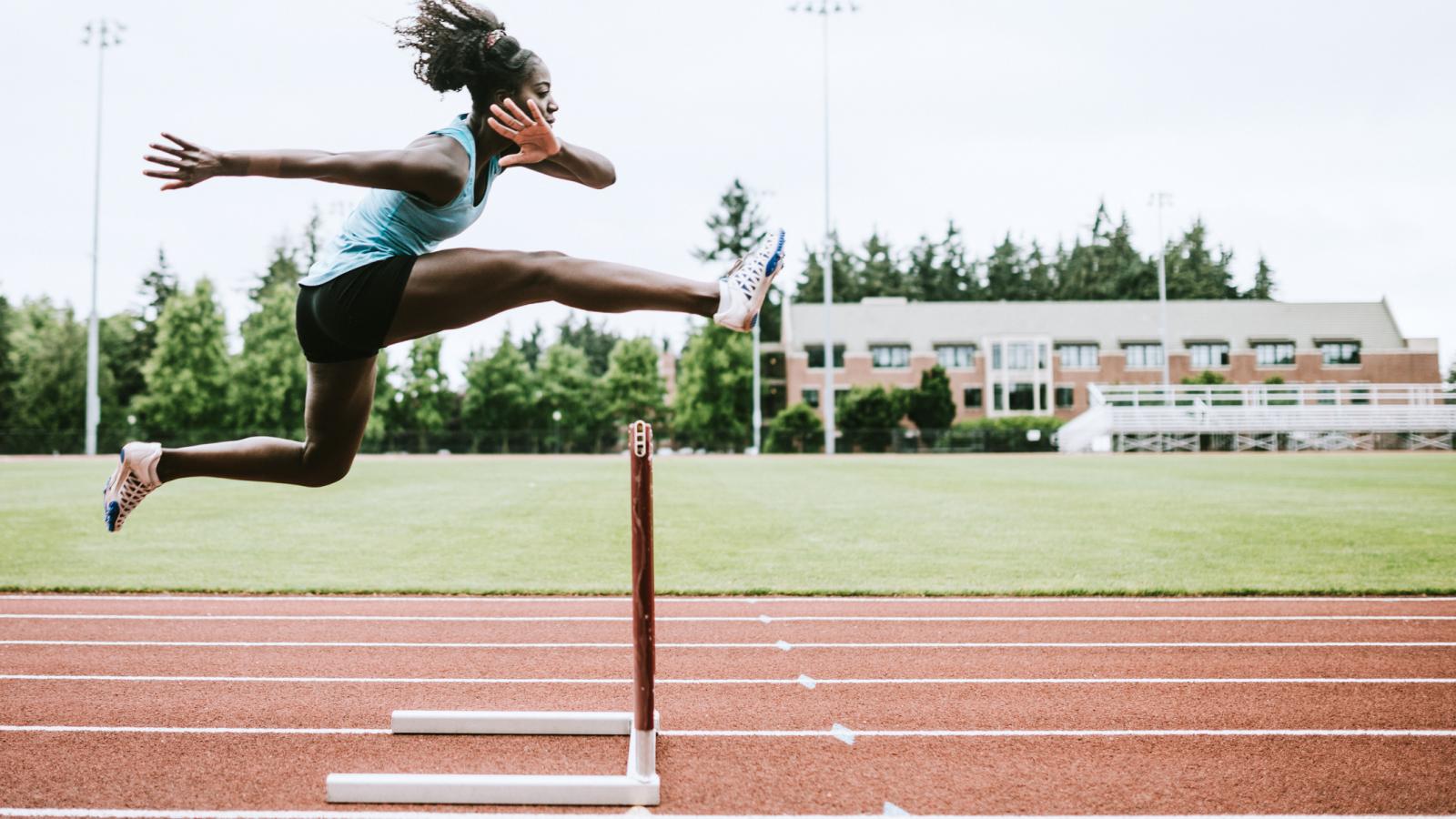 Woman running hurdles