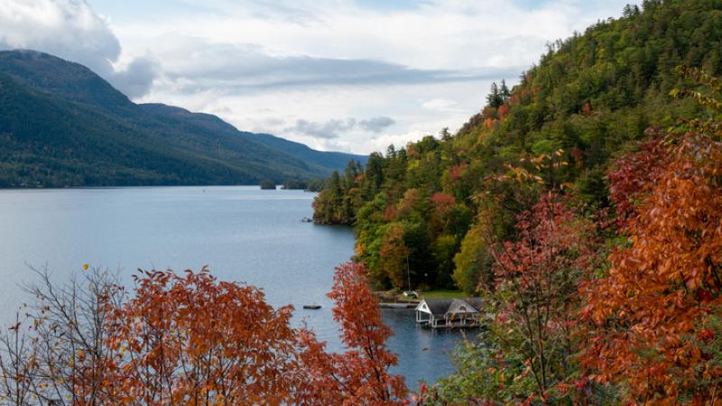 Clear lake surrounded by fall foliage