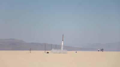 Small rocket shooting into the sky