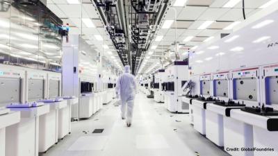 Man walking in GlobalFoundries clean room